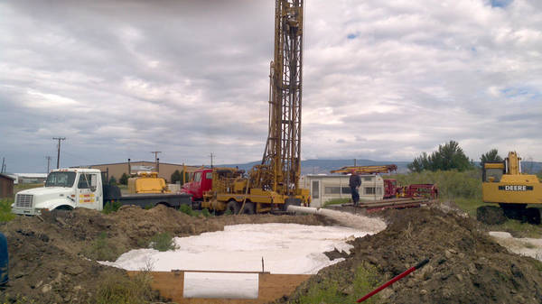 Drilling rig and equipment on site drilling a municipal well